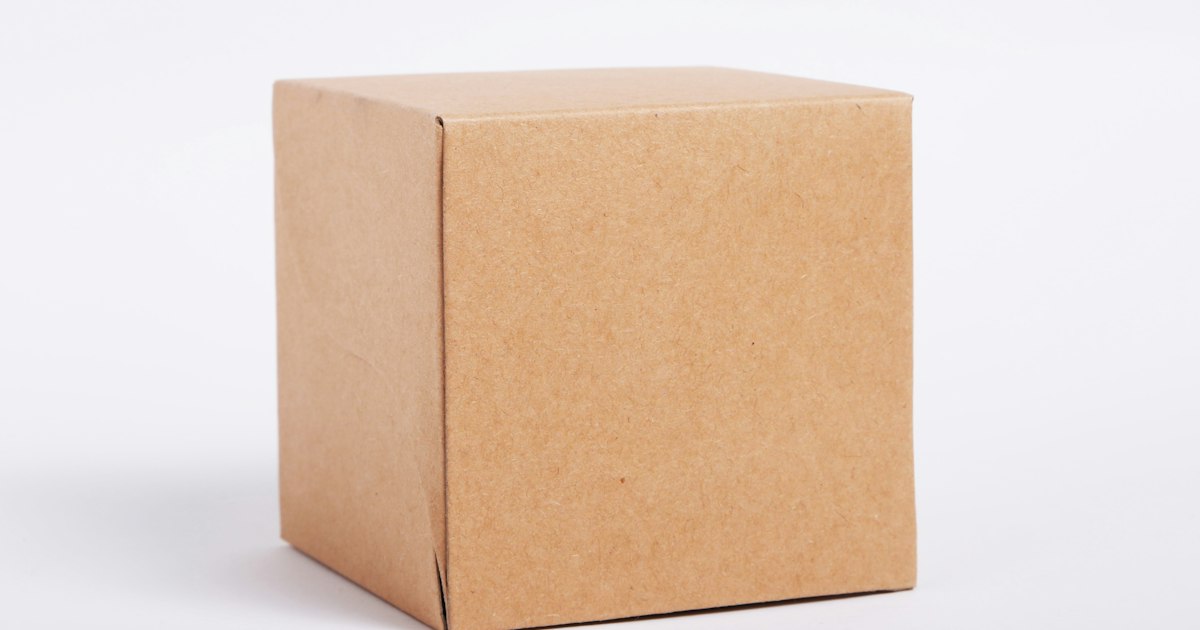 A plain, undamaged brown cardboard box on a white surface.
